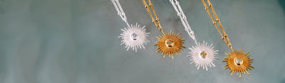 Stages Photo of Silver and Gold Sun Pendants