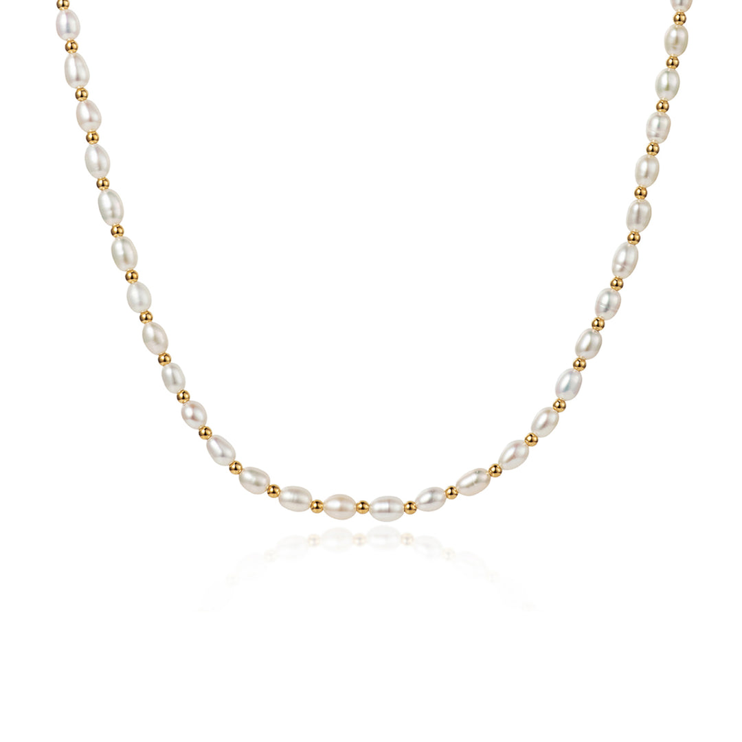 Freshwater seed pearl choker necklace with gold beads on a white background