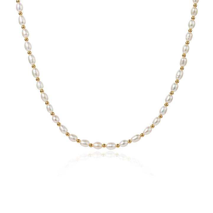 Freshwater seed pearl choker necklace with gold beads on a white background