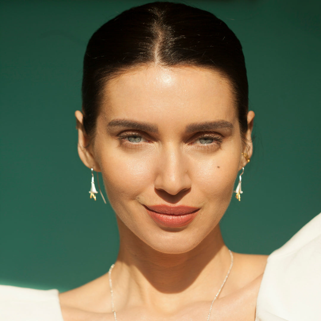 Model Wearing Fuchsia Flower Earring In Silver