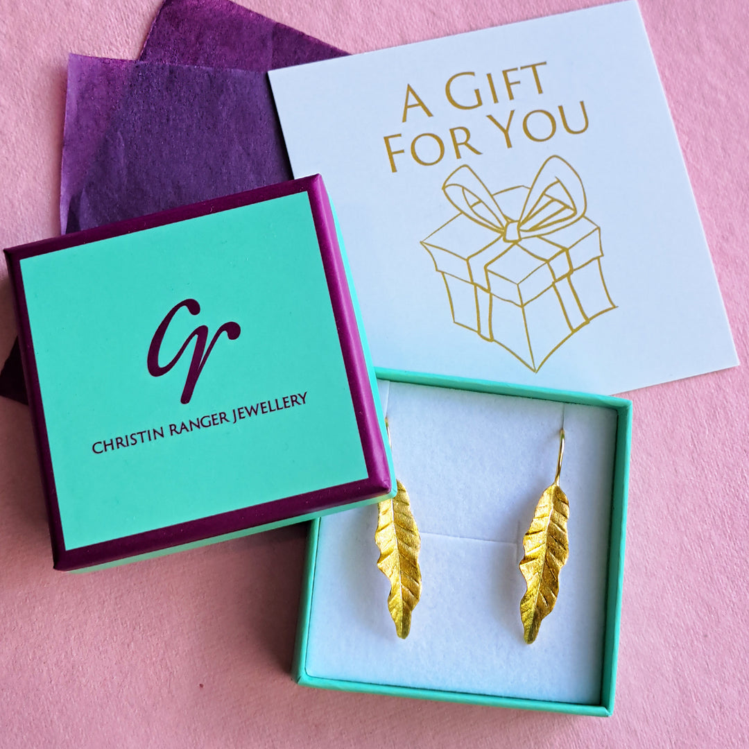 Gold vermeil leaf drop earrings in Christin Ranger gift packaging