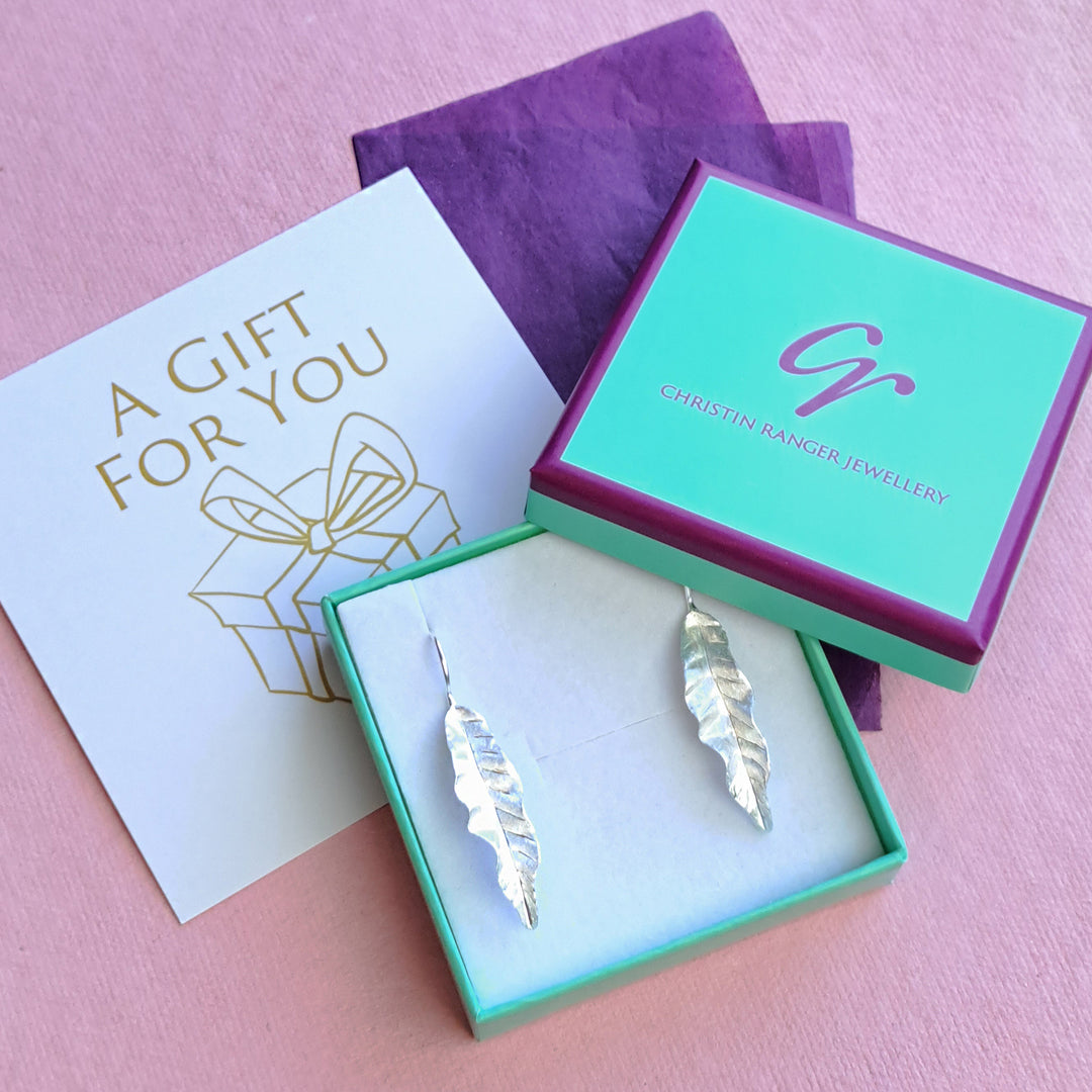 Sterling silver leaf threader drop earrings in Christin Ranger gift packaging