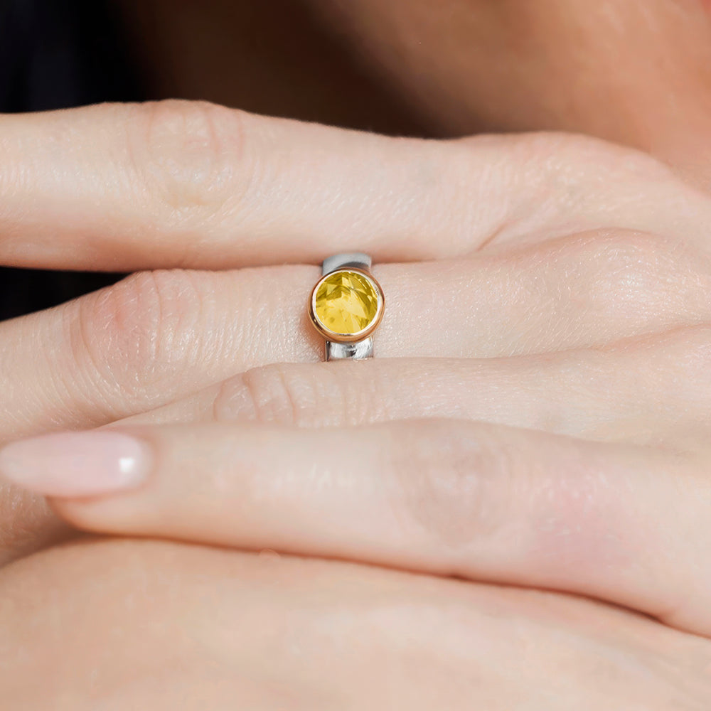 Close-up of hand wearing a citrine ring in sterling silver & 18ct gold vermeil 