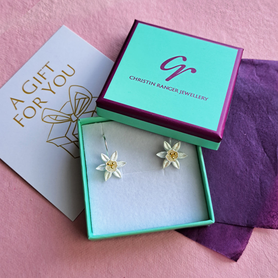 Sterling silver daffodil flower drop earrings in Christin Ranger gift packaging