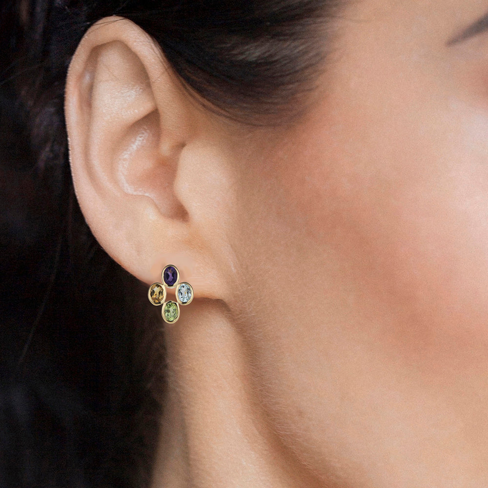 Close-up of model wearing multi-colour gemstone stud earrings in gold vermeil
