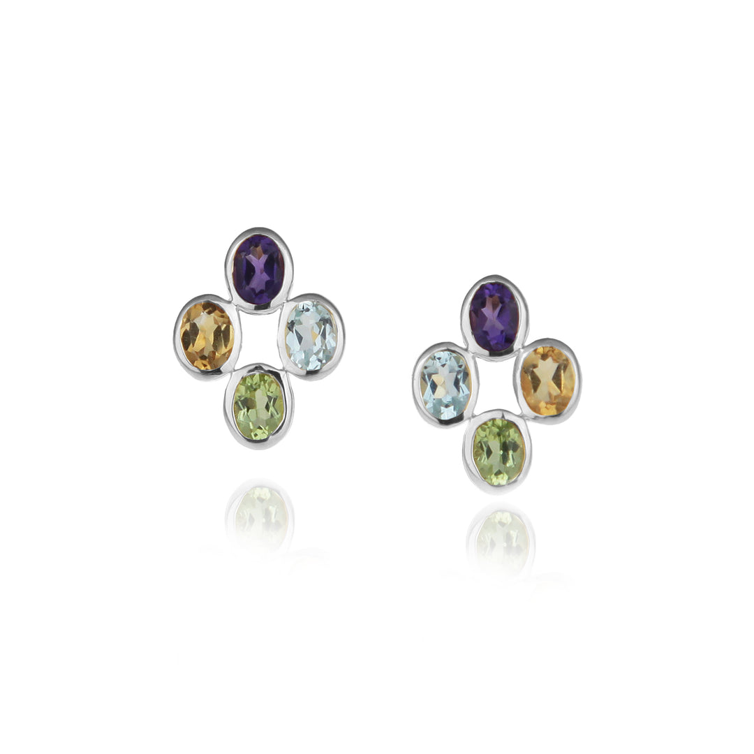 Pair of silver stud earrings with multicolored gemstones on a white background