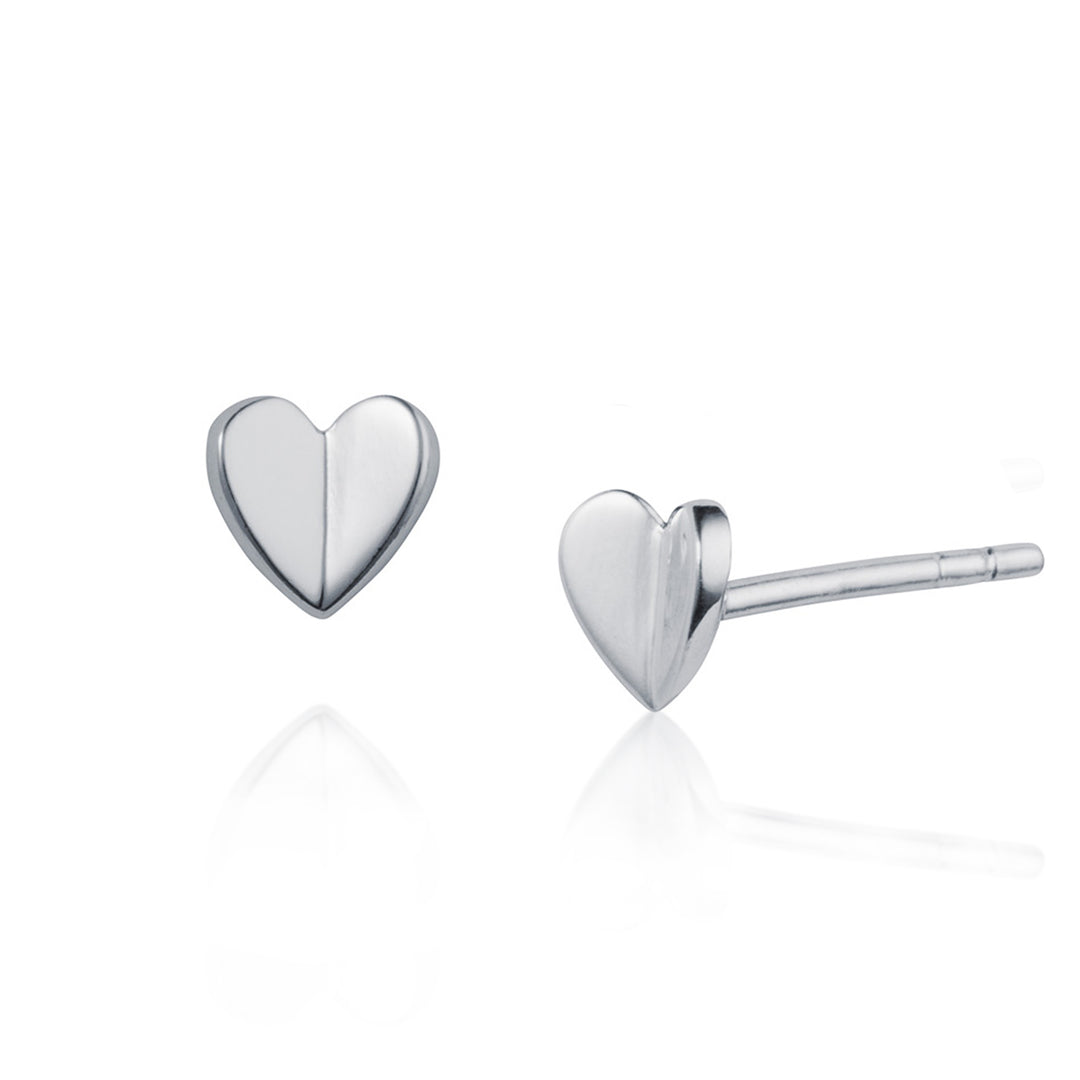 Heart-shaped silver stud earrings on a white background