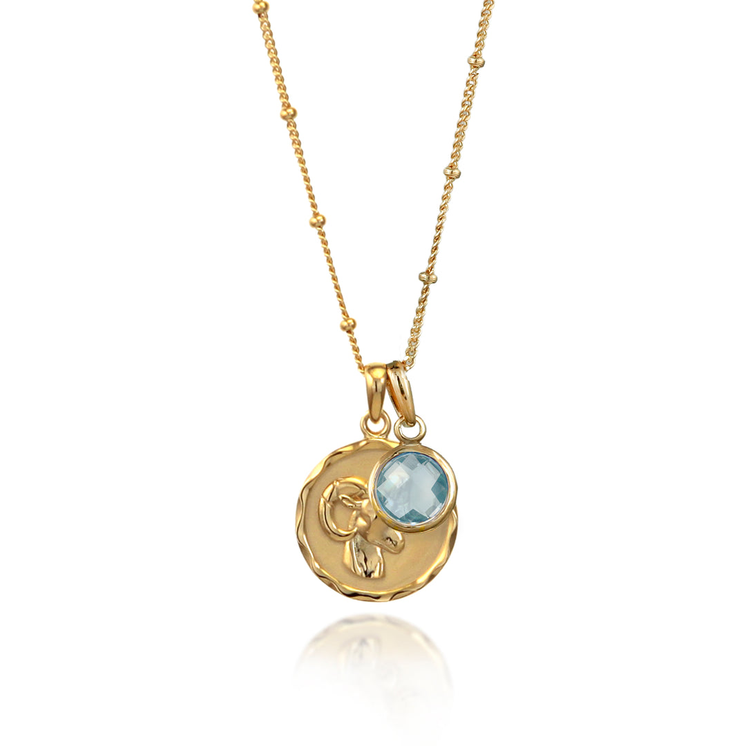 Gold vermeil Aries zodiac necklace with a blue topaz March birthstone charm
