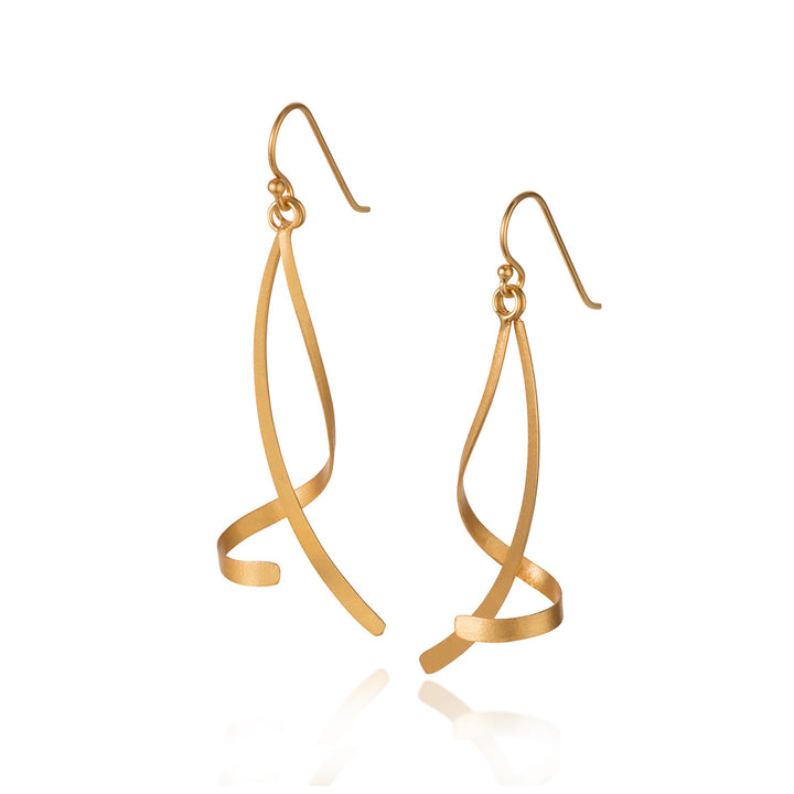 Gold twisted dangle earrings on a white background