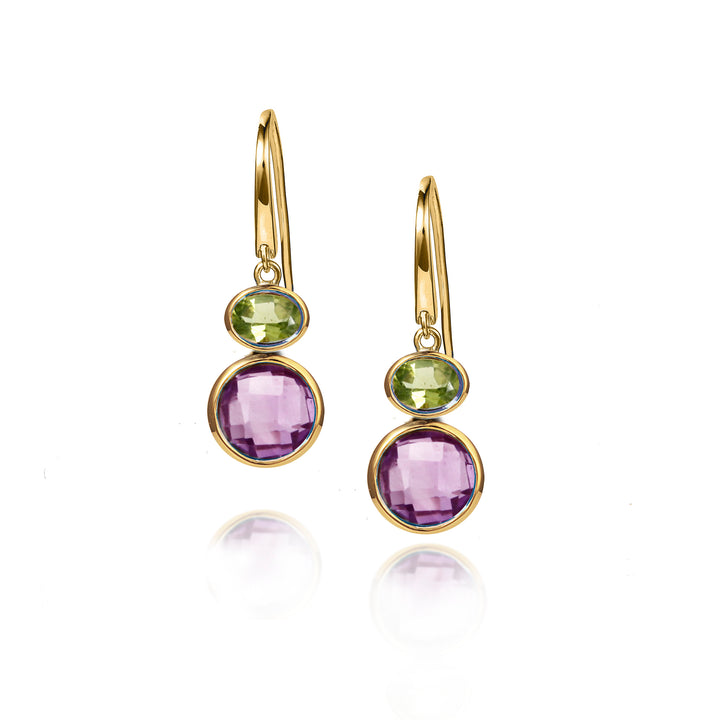 Gold earrings with purple and green gemstones on a white background