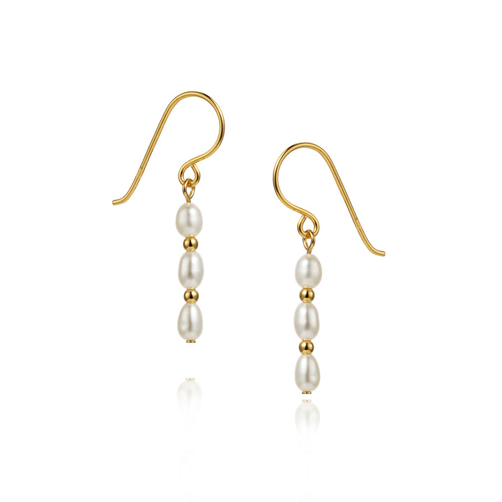 Pearl and gold beaded hook earrings on a white background