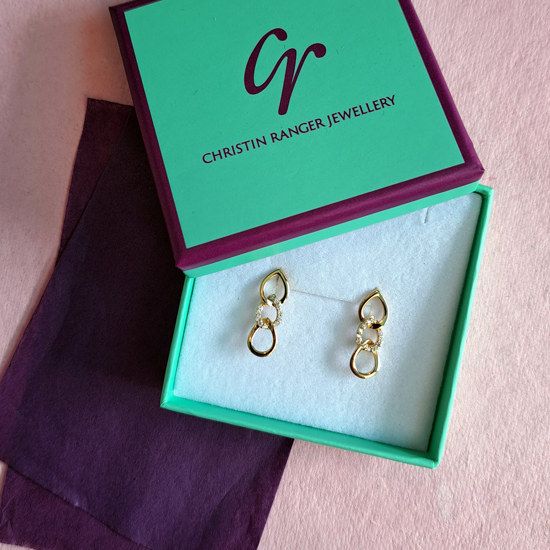 Gold short drop stud earrings with cubic zirconia in Christin Ranger Jewellery gift packaging