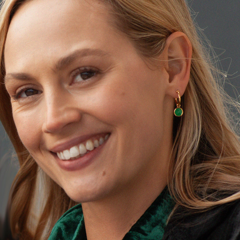 Model wearing green quartz and gold vermeil hoop earrings