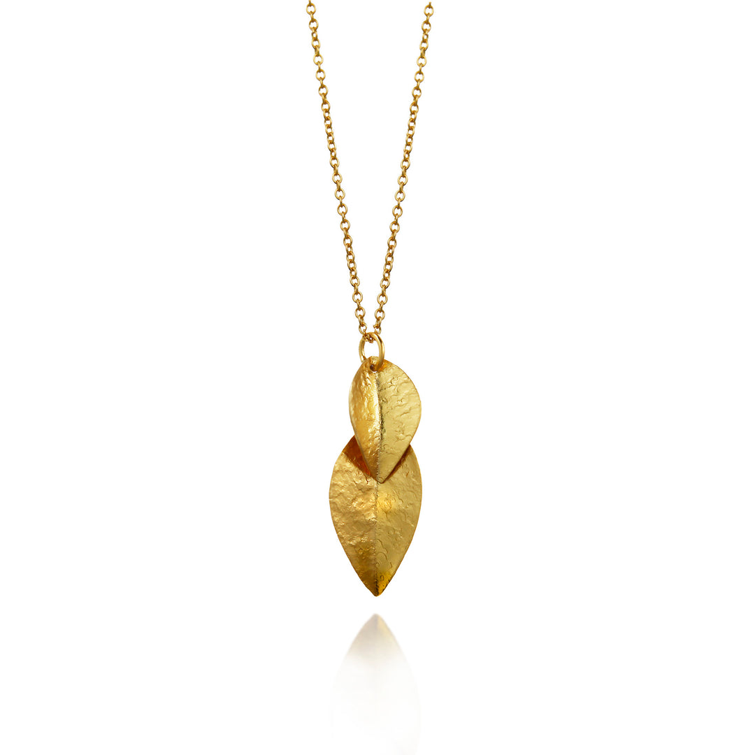 Gold necklace with leaf-shaped pendants on a white background