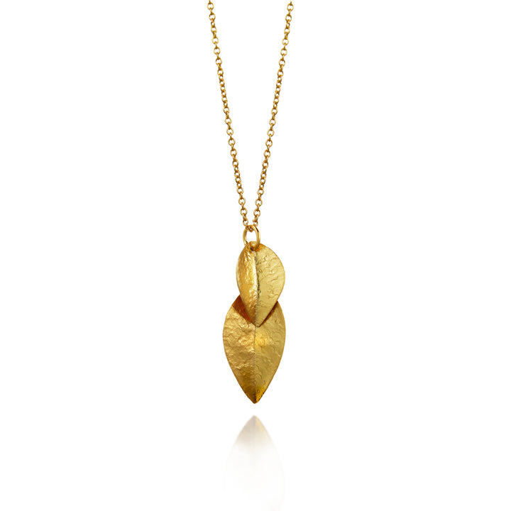 Gold necklace with leaf-shaped pendants on a white background