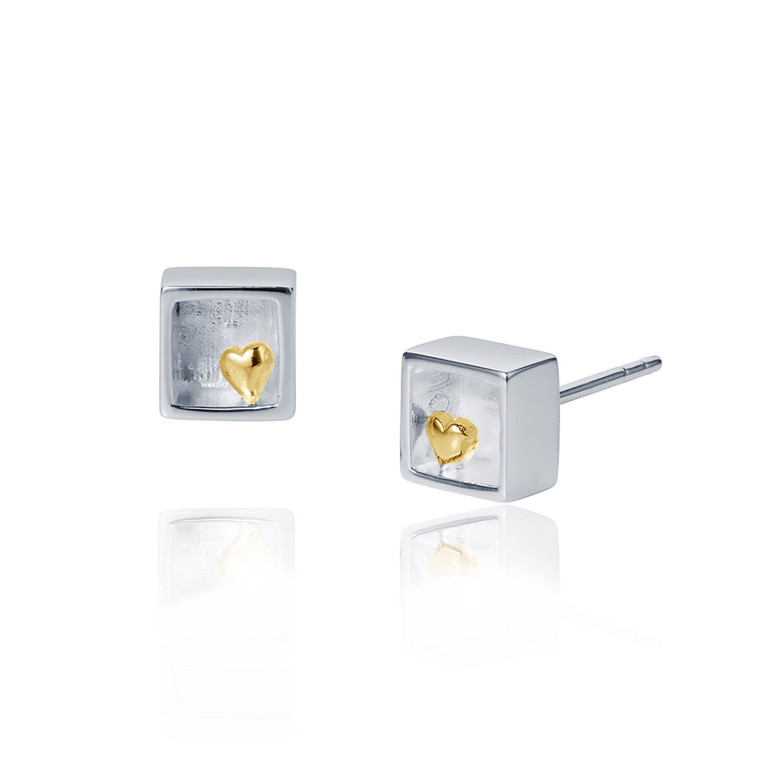 Silver square earrings with gold heart details on a white background