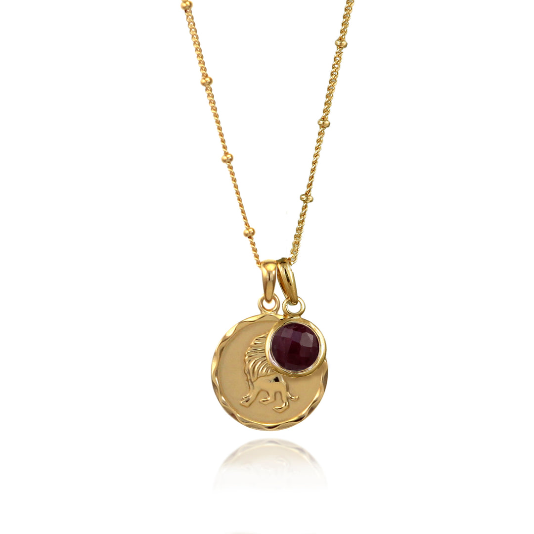 Gold Leo zodiac star sign necklace with ruby July birthstone charm