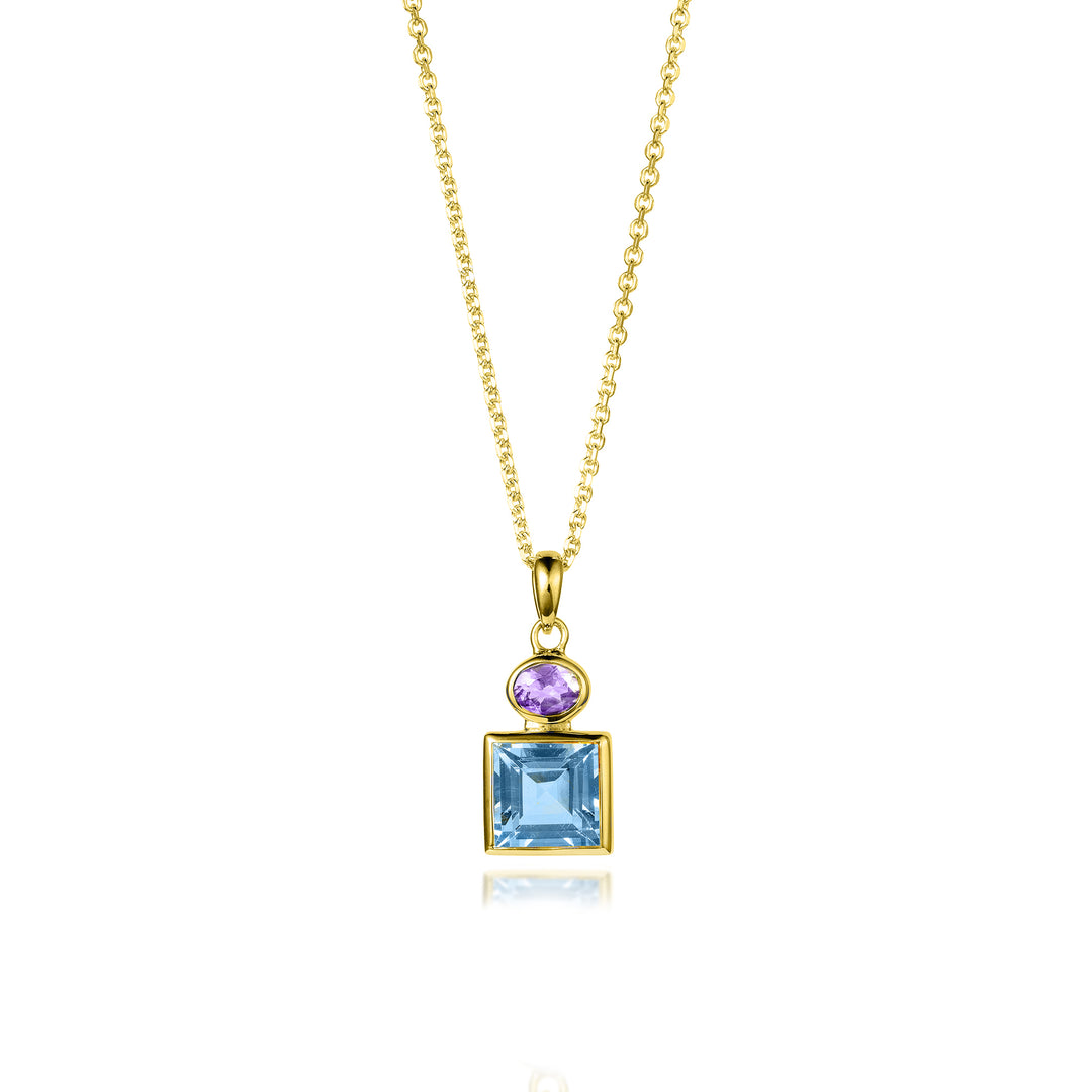 Gold necklace with a pendant featuring a square blue topaz and oval amethyst gemstone on a white background 
