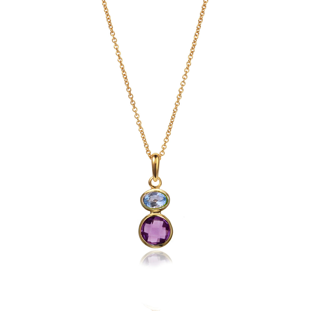 Gold necklace with a pendant featuring blue topaz and amethyst gemstones on a white background