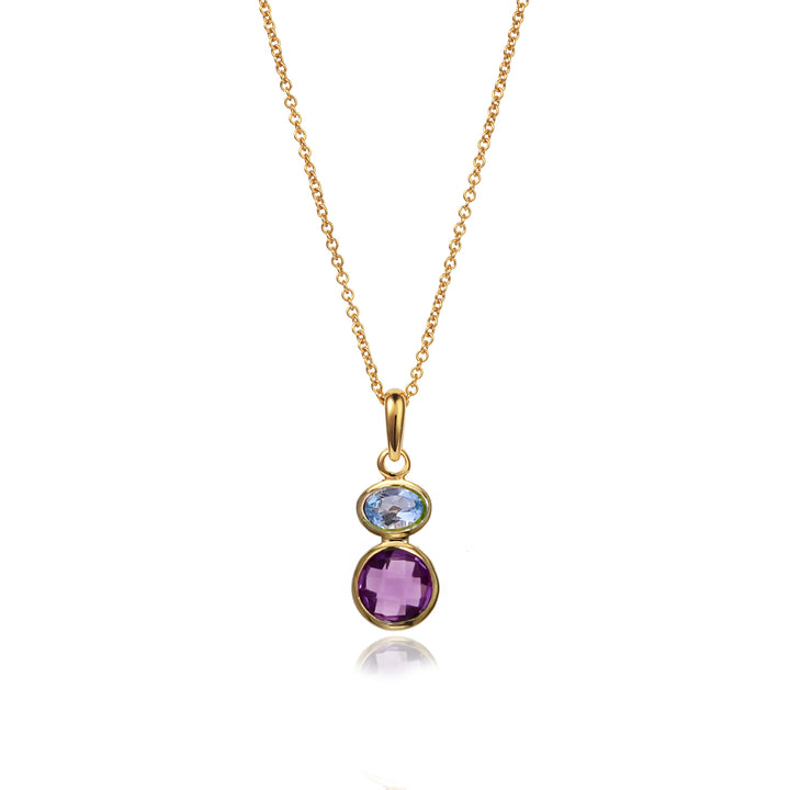 Gold necklace with a pendant featuring blue topaz and amethyst gemstones on a white background