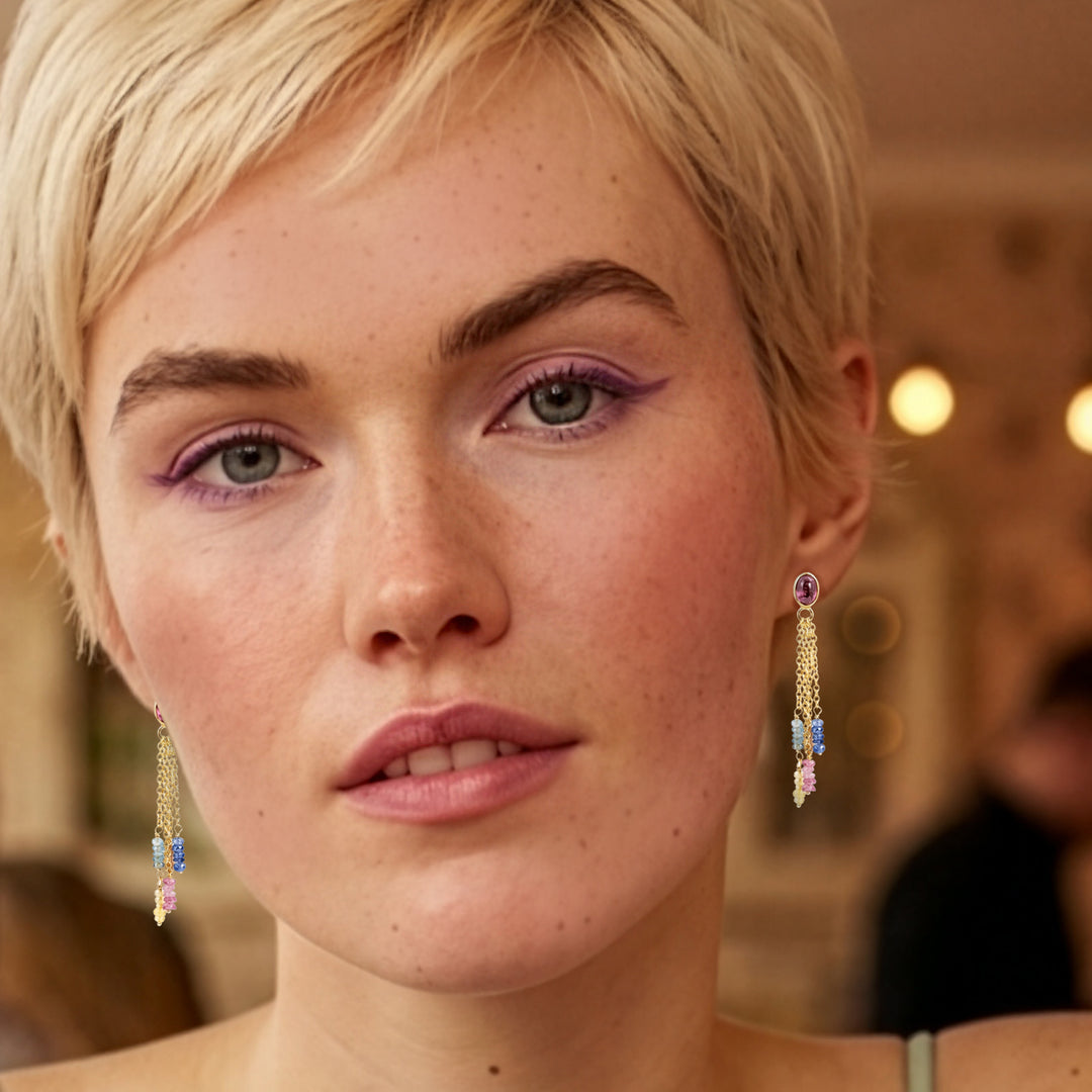 Close-up of a model wearing 18ct gold vermeil pink tourmaline and sapphire chandelier drop earrings