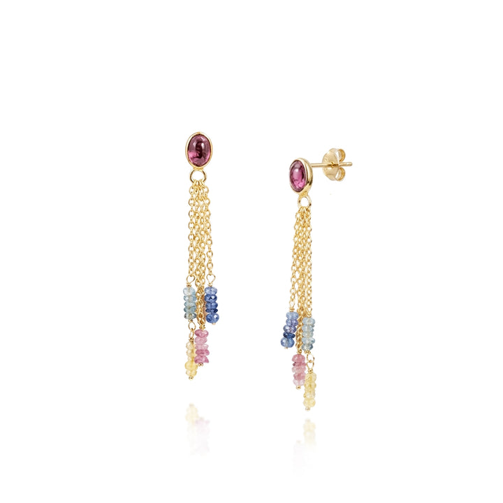Gold drop earrings with tourmaline and sapphire gemstones on a white background