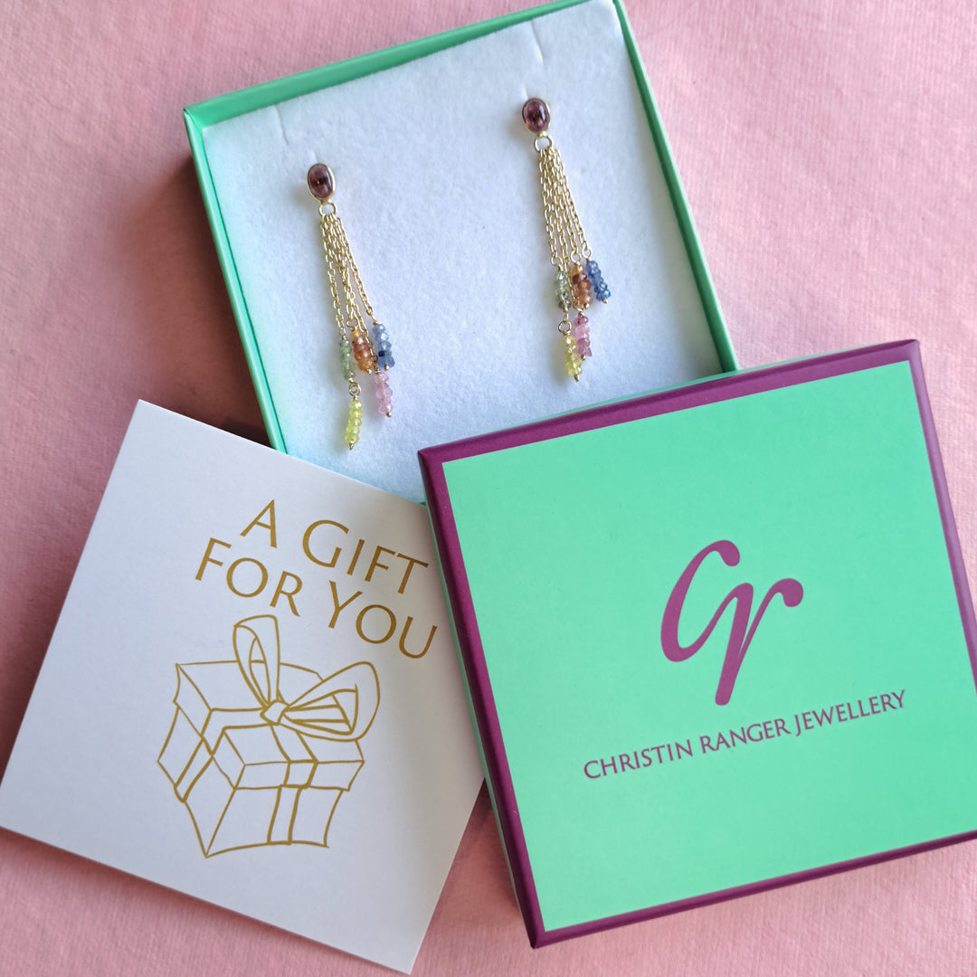 Gold and tourmaline drop earrings packaged in Christin Ranger gift boxes with gift note.