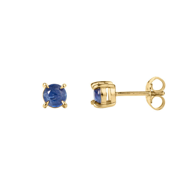 Gold stud earrings with blue gemstones on a white background