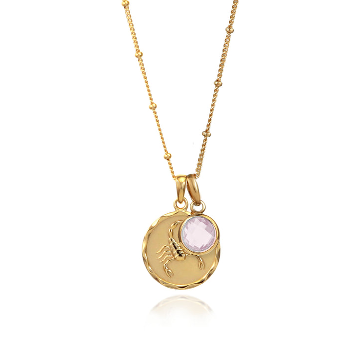 Gold zodiac pendant  with scorpio star sign and rose quartz october charm on white background