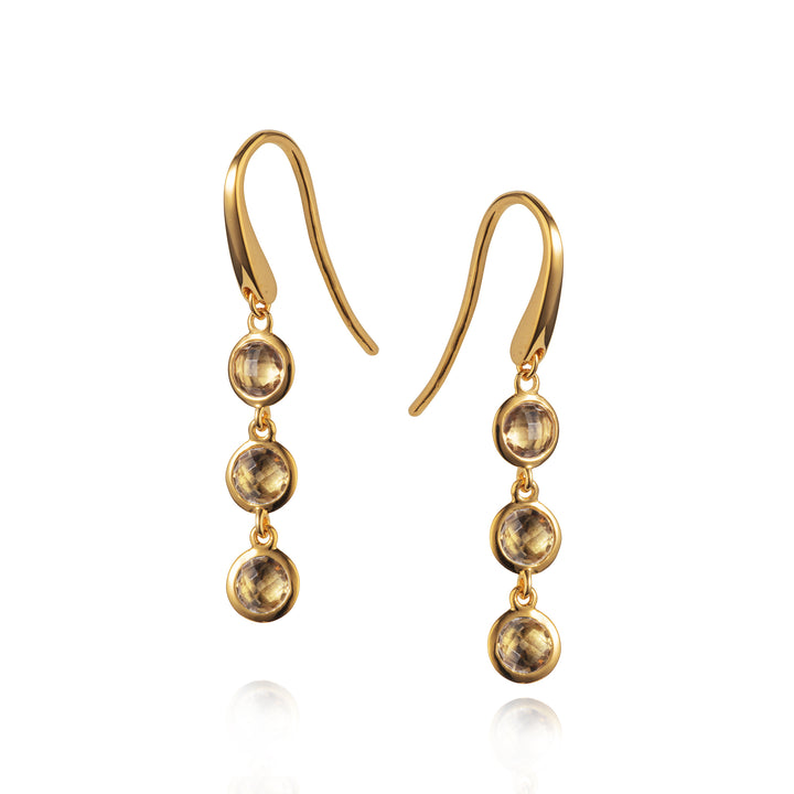 Triple drop gold vermeil earrings set with smoky quartz on a white background