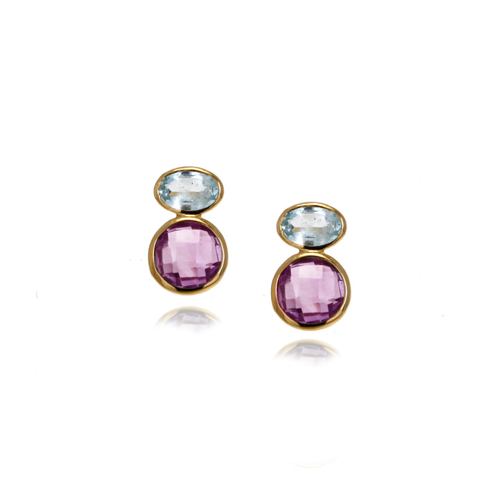 Pair of gold earrings with purple and blue gemstones on a white background
