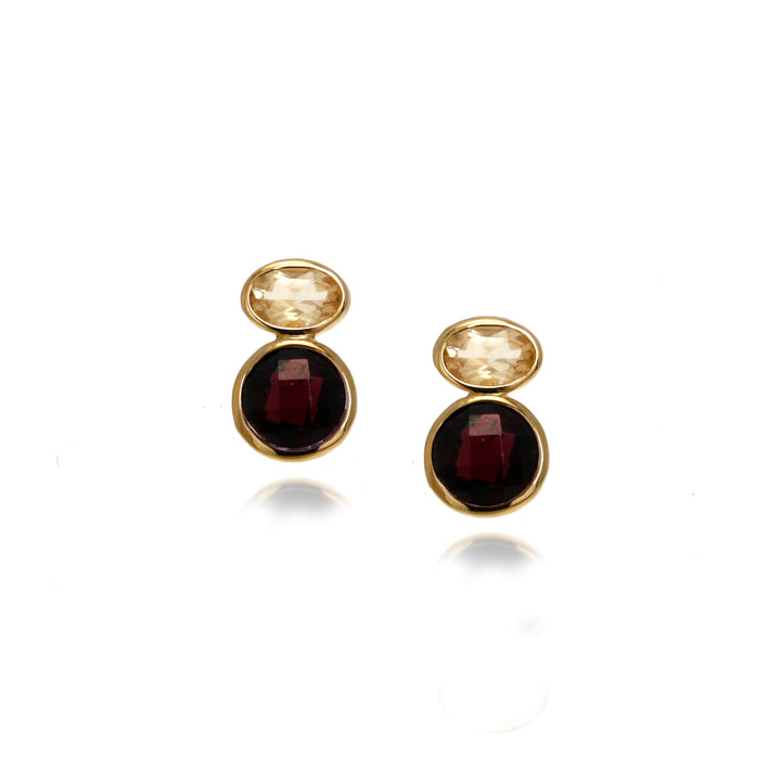 Pair of gold stud earrings with red and yellow gemstones on a white background