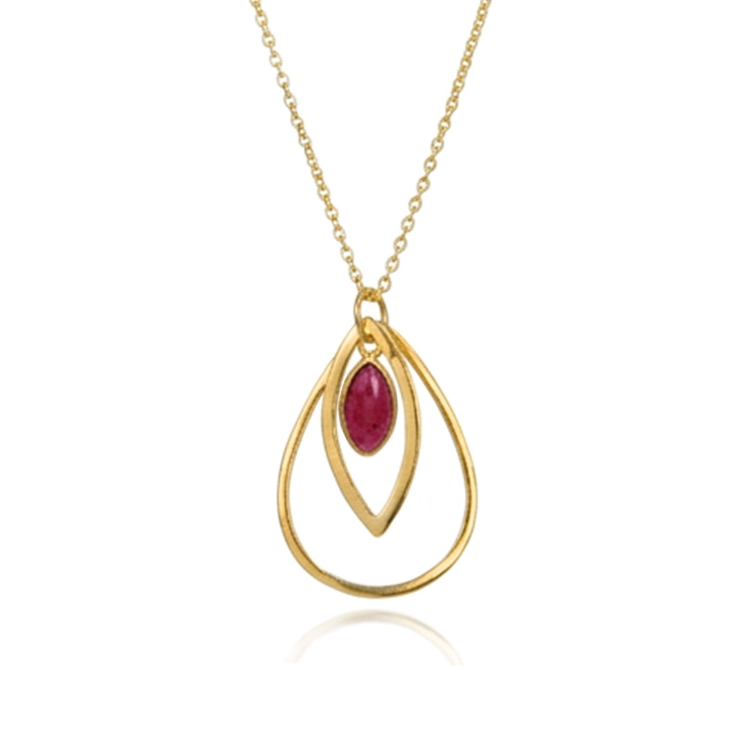 Gold peardrop-shaped pendant with a dark red cabochon gemstone on a white background.