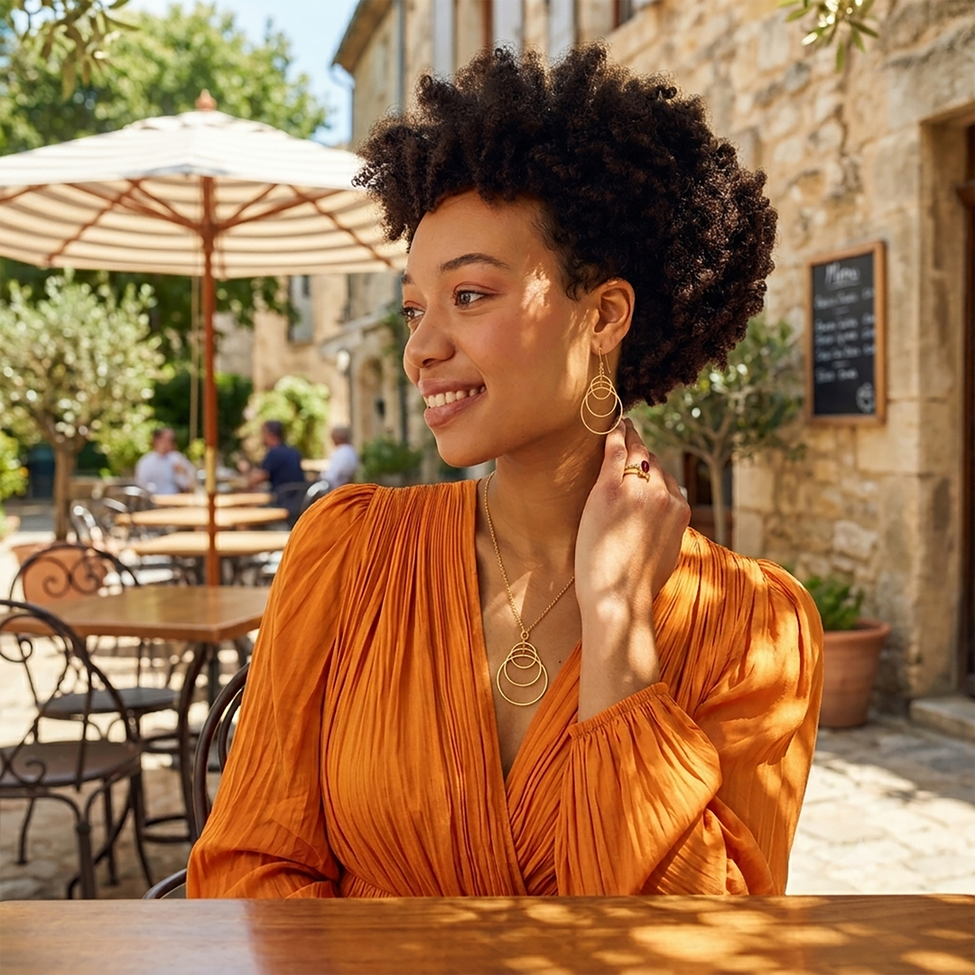 Model wearing gold vermeil earring and necklace set from Christin Ranger Jewellery