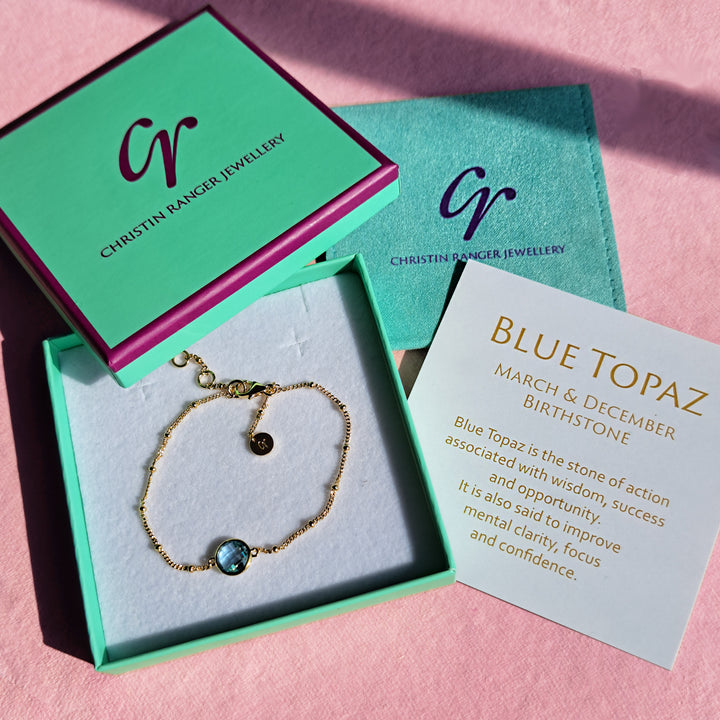 Gold vermeil beaded chain bracelet with blue topaz in a Christin Ranger gift box with card