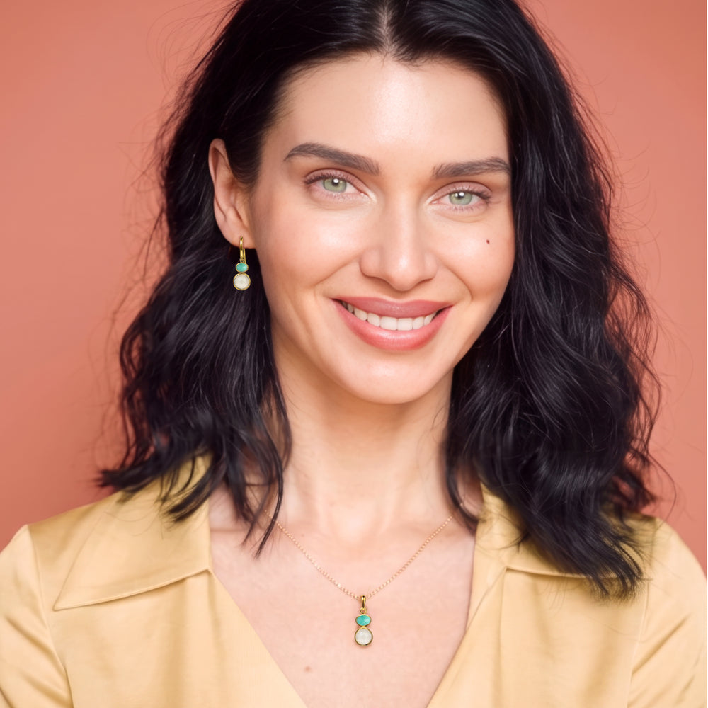 Woman wearing 18ct gold vermeil earring and necklace set with moonstone & amazonite