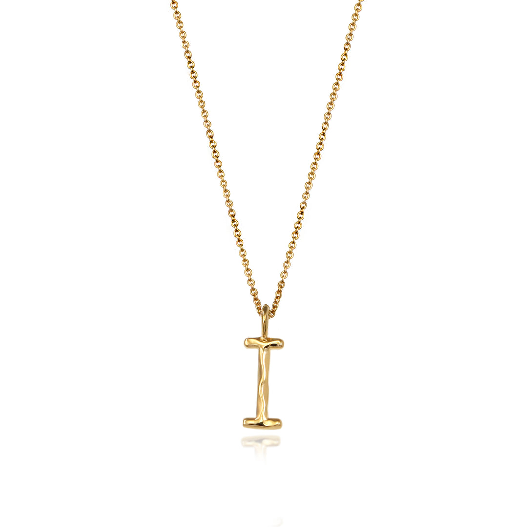 Gold vermeil letter I initial necklace pendant with chain on a white background.