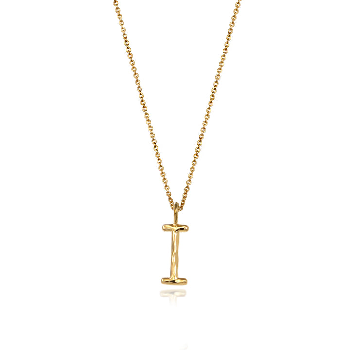 Gold vermeil letter I initial necklace pendant with chain on a white background.