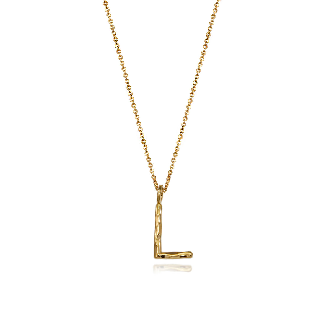 Gold vermeil letter L initial necklace pendant with chain on a white background.