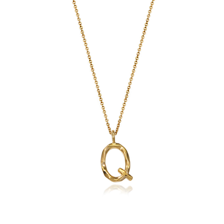 Gold vermeil letter Q initial necklace pendant with chain on a white background.
