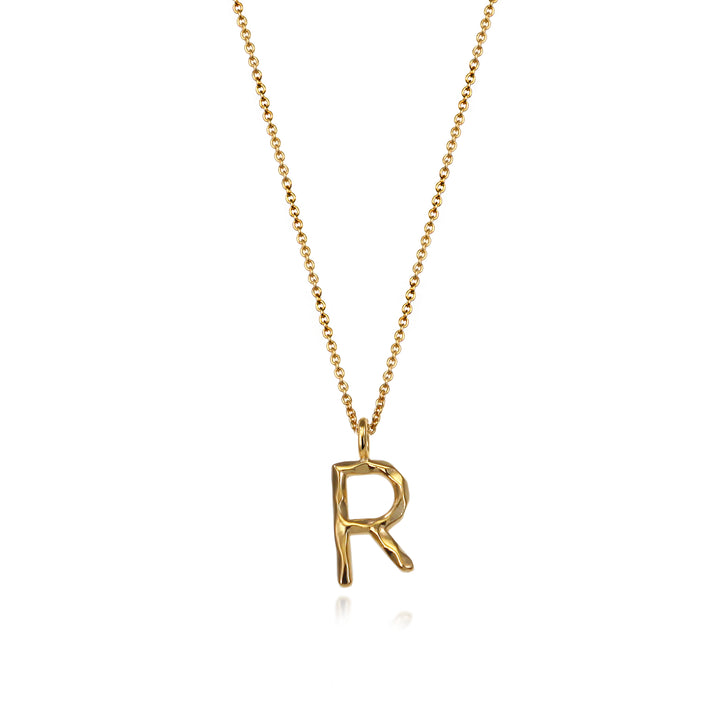 Gold vermeil letter R initial necklace pendant with chain on a white background.