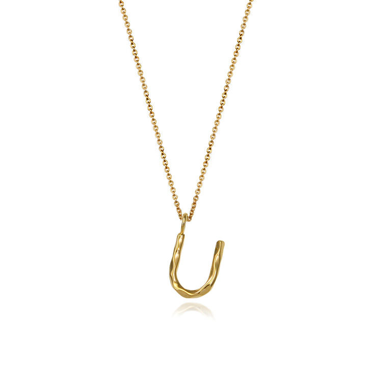Gold vermeil letter U initial necklace pendant with chain on a white background.