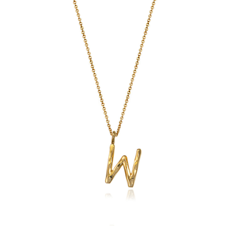 Gold vermeil letter W initial necklace pendant with chain on a white background.