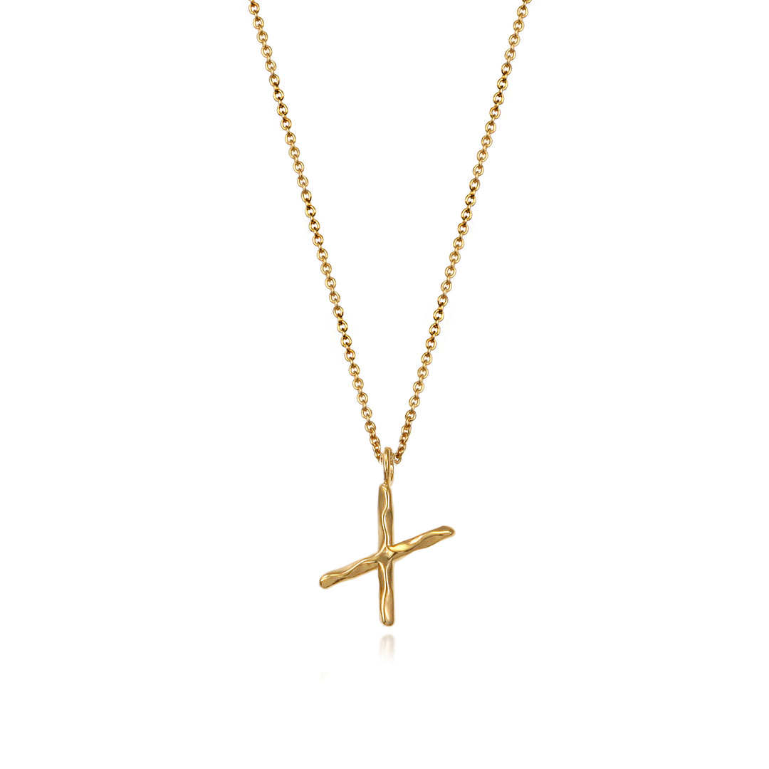 Gold vermeil letter X initial necklace pendant with chain on a white background.