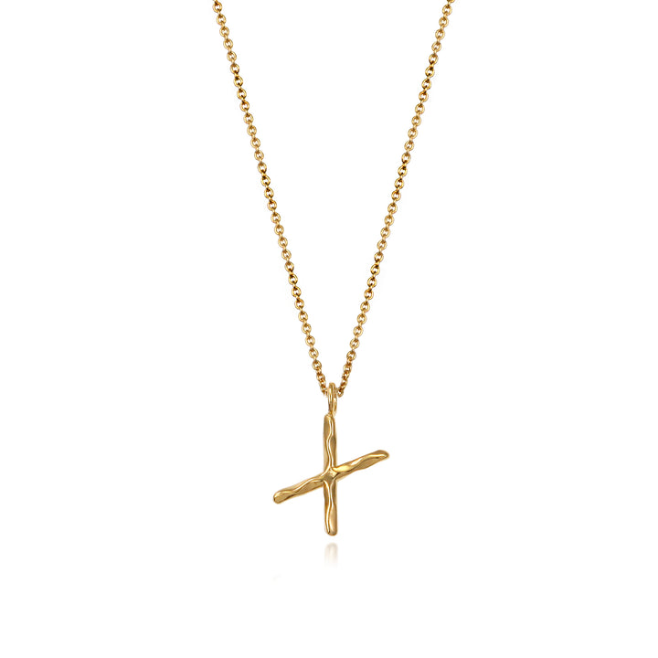 Gold vermeil letter X initial necklace pendant with chain on a white background.