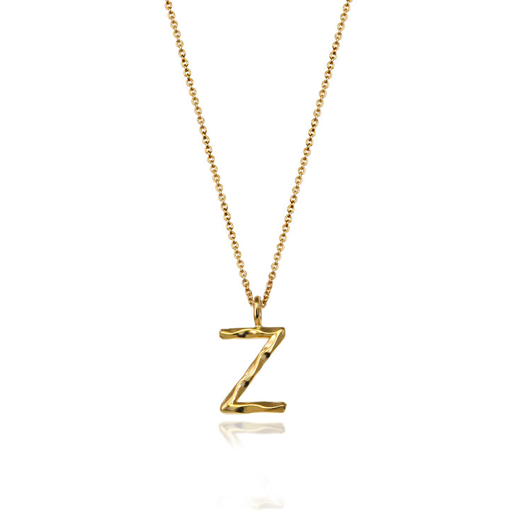 Gold vermeil letter Z initial necklace pendant with chain on a white background.
