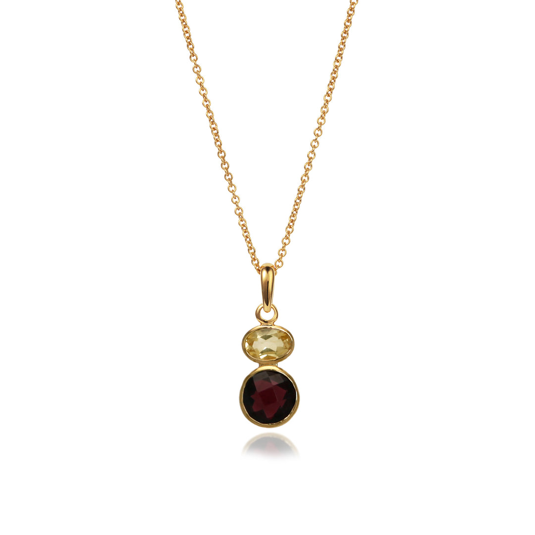 Gold necklace with a garnet and citrine pendant on a white background