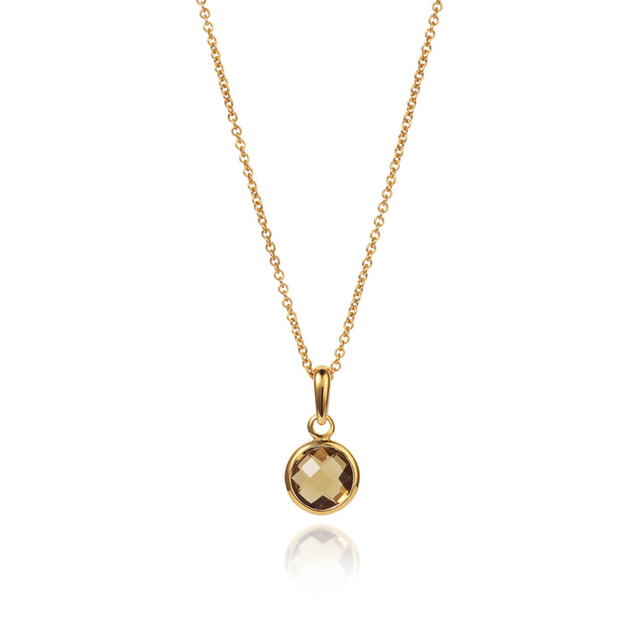 gold necklace with a smoky quartz pendant on a chain