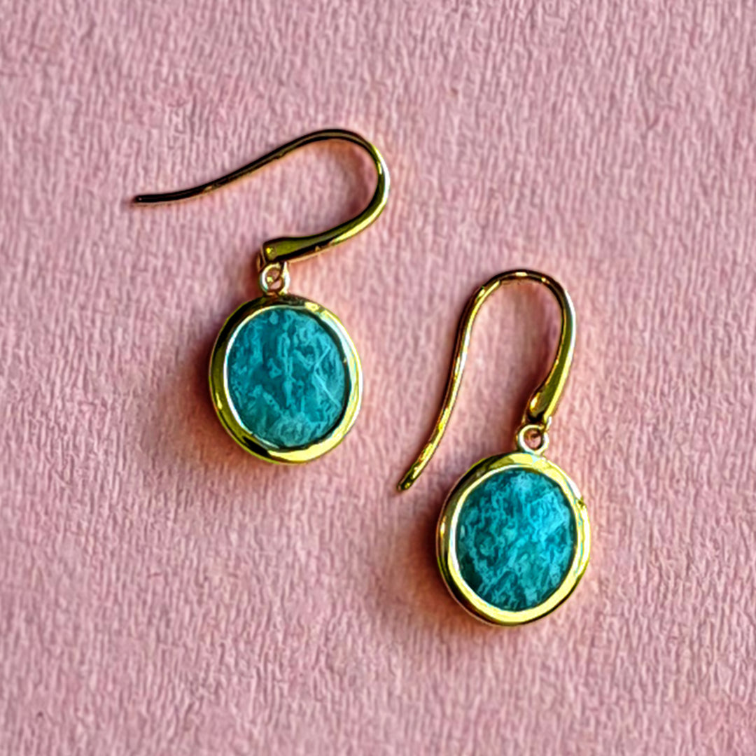 Gold vermeil oval drop earrings with amazonite on pink background
