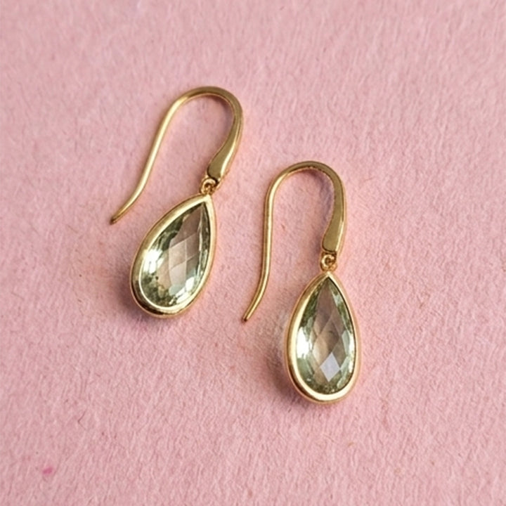 18ct gold vermeil pear drop earrings with green amethyst on pink background